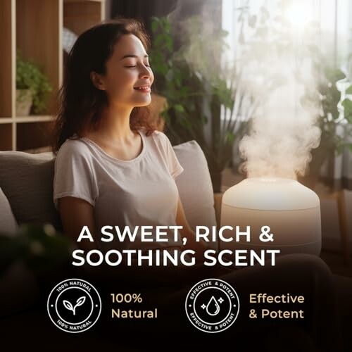 Woman enjoying a soothing scent from an aromatherapy diffuser.